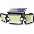 Compact Solar Security Floodlight With Three Adjustable Heads Mounted Above A Back Door Illuminating The Garden Path At Night
