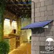 Solar Powered LED Shed Light Kit Installed Inside A Wooden Garden Shed Illuminating Tools And Plant Pots With Pull Cord