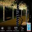 Solar rope lights used to guide a garden pathway, wrapped around trees and installed on patio steps, providing decorative and functional outdoor lighting