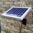 Sunspray SE500 Solar Fountain Pump Showing the solar panel mounted to a wall with the mounting bracket