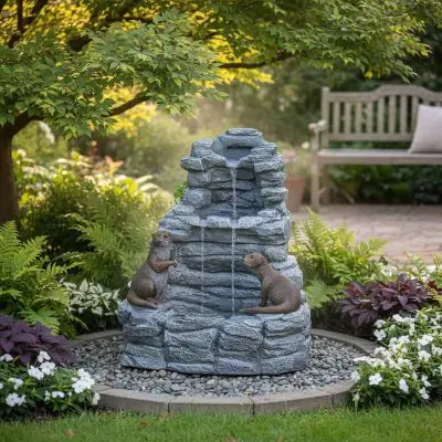 Otter Falls Solar Cascade – stone-effect multi-drop cascade with otter sculptures in garden