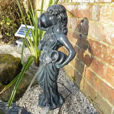 Lucia Solar Pond Spitter Statue beside pond spitting water
