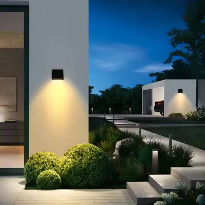 Premium 1000 Lumen Solar Wall Light – Ultra Slim, ALS, PIR installed on a wall highlighting a pathway 
