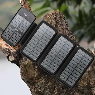 Professional Solar mobile Charger Charging in the sun hung from a carabina