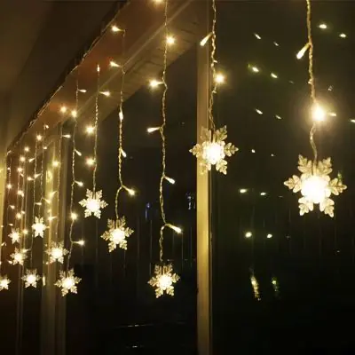 Solar Christmas Snowflake Lights – LED Outdoor String with Remote Hanging on a customers window outside their house