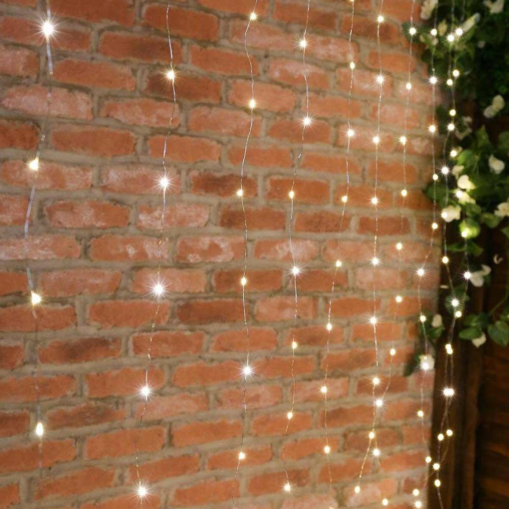 ConnectGo Curtain Lights 300 Warm White LEDs 2m x 3m on wall outside