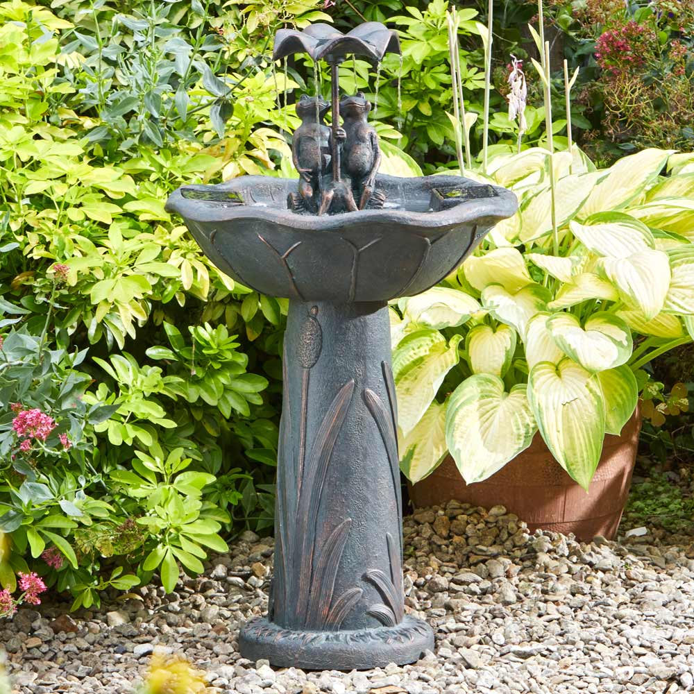 Solar Powered Duck Family Water Feature in garden