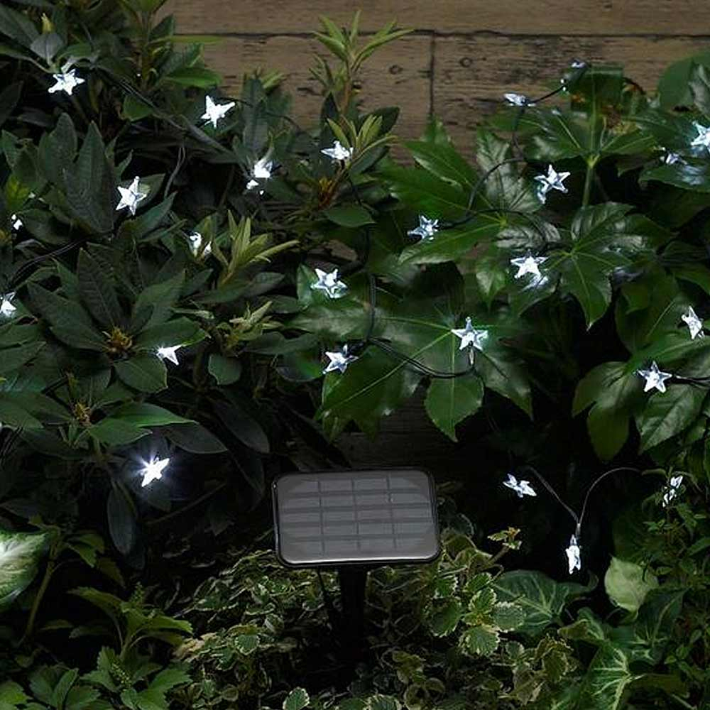 Smart Solar Strings 30 Stars in garden at night on bush