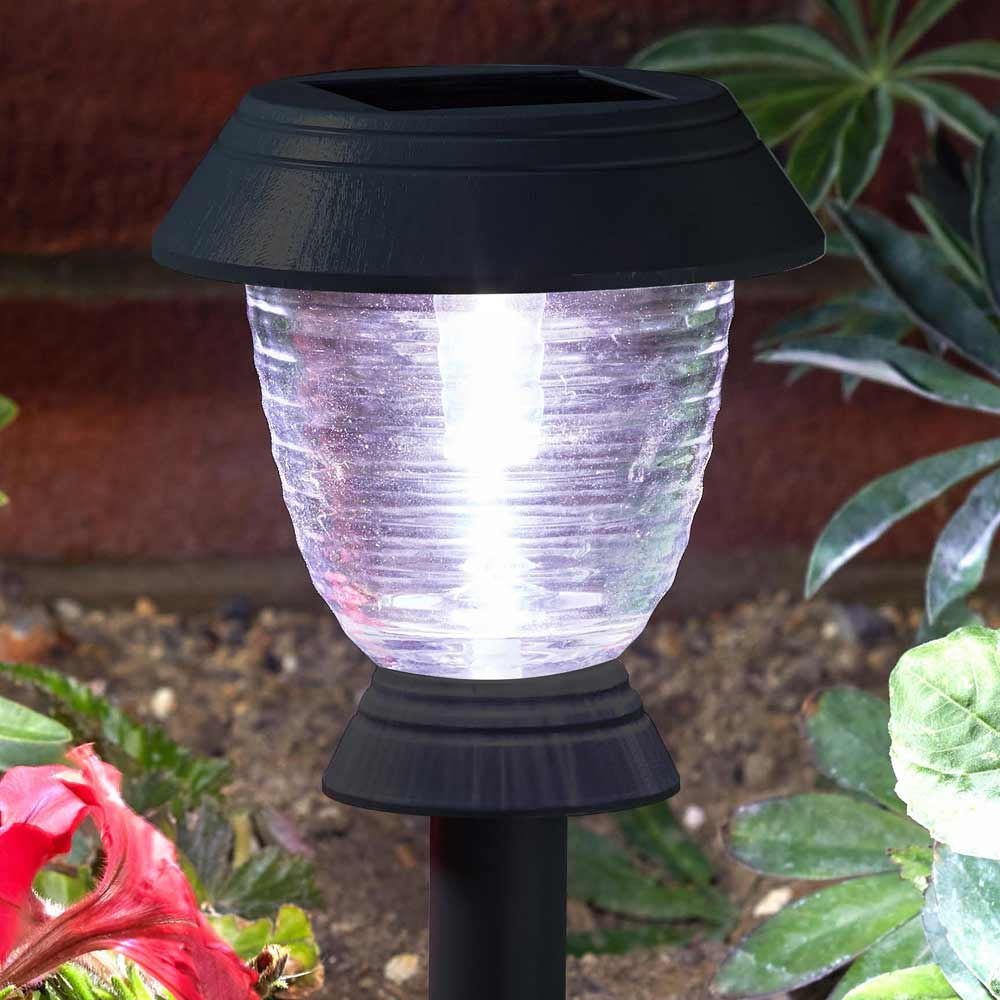 Triton 365 Solar Stake Light close up of glass lens in garden